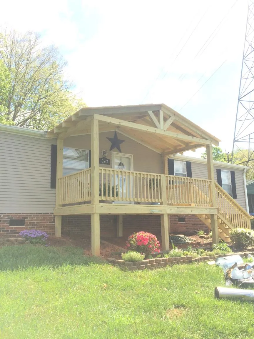 New gabled porch roof and deck railing added to a ranch home in Morristown